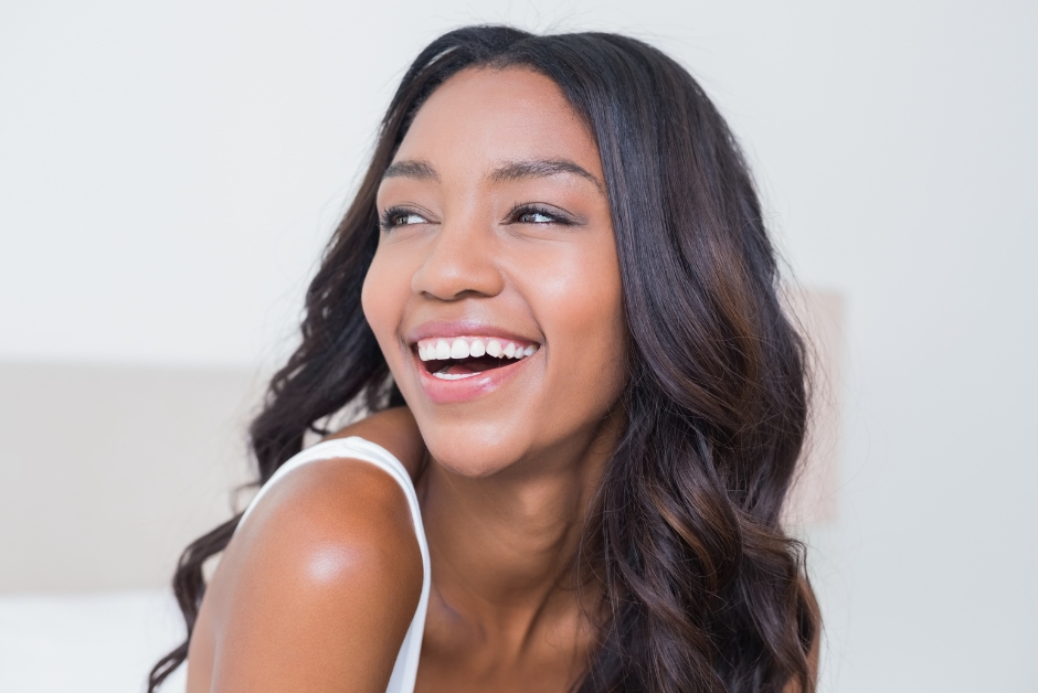 A woman happily smiling