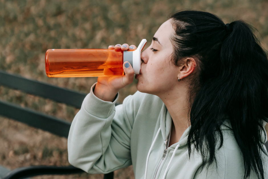 Woman drinking from bottle