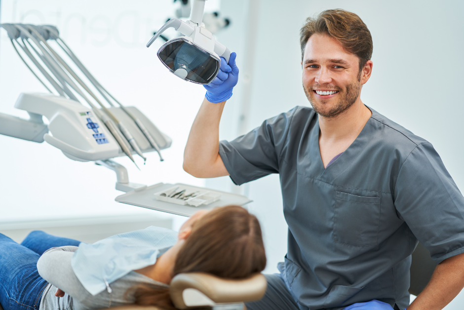 Male dental professional with patient in the chair